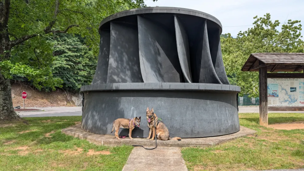 Aiken and Corona posing with turbine generator at Smith Mountain Dam
